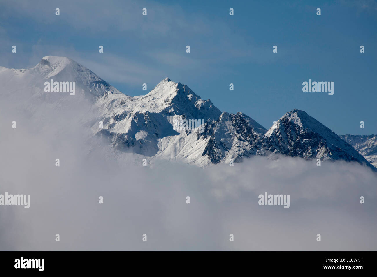 Cloud and mist swirling around mount summits above Kaprun Hohe Tauern National Park  Pinzgau Salzburgerland Austria Stock Photo