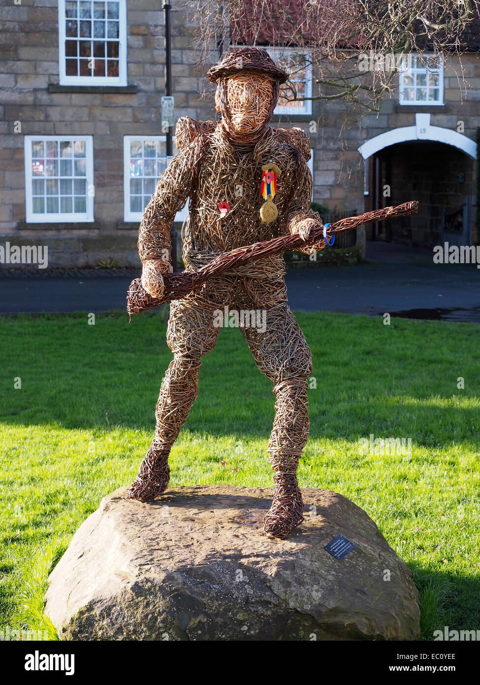 Osier sculpture of a First World War Soldier in remembrance of the people  from Great Ayton who died in war with a knitted medal Stock Photo - Alamy