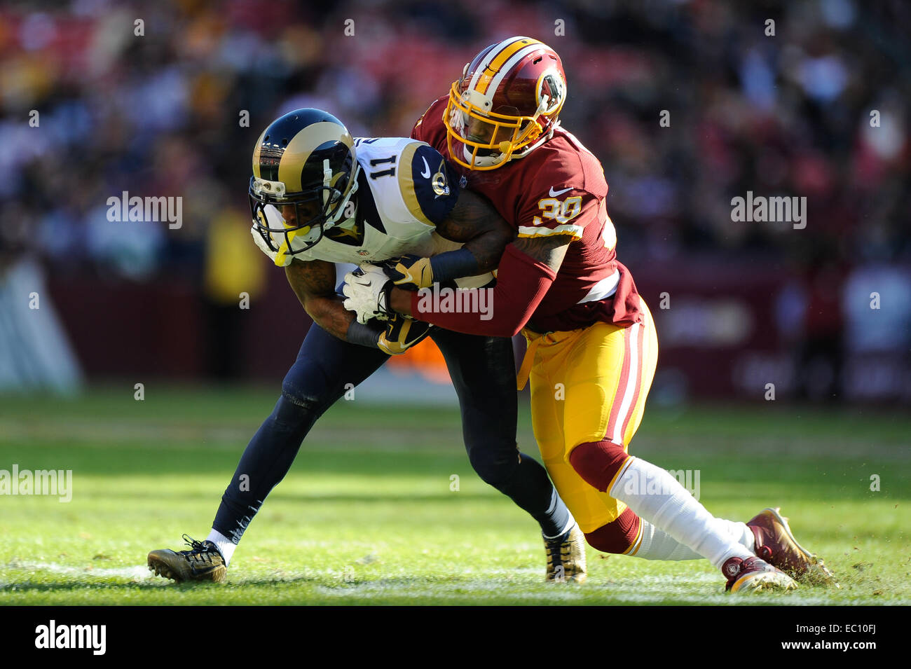 Landover, Maryland, USA. 07th Dec, 2014. Washington Redskins cornerback David Amerson (39) tackles St. Louis Rams wide receiver Tavon Austin (11) during the matchup between the St. Louis Rams and the Washington Redskins at FedEx Field in Landover, MD. Credit:  Cal Sport Media/Alamy Live News Stock Photo