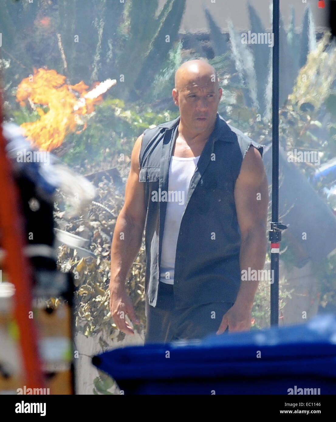 Vin Diesel shows off his biceps while filming an action scene for 'Fast ...