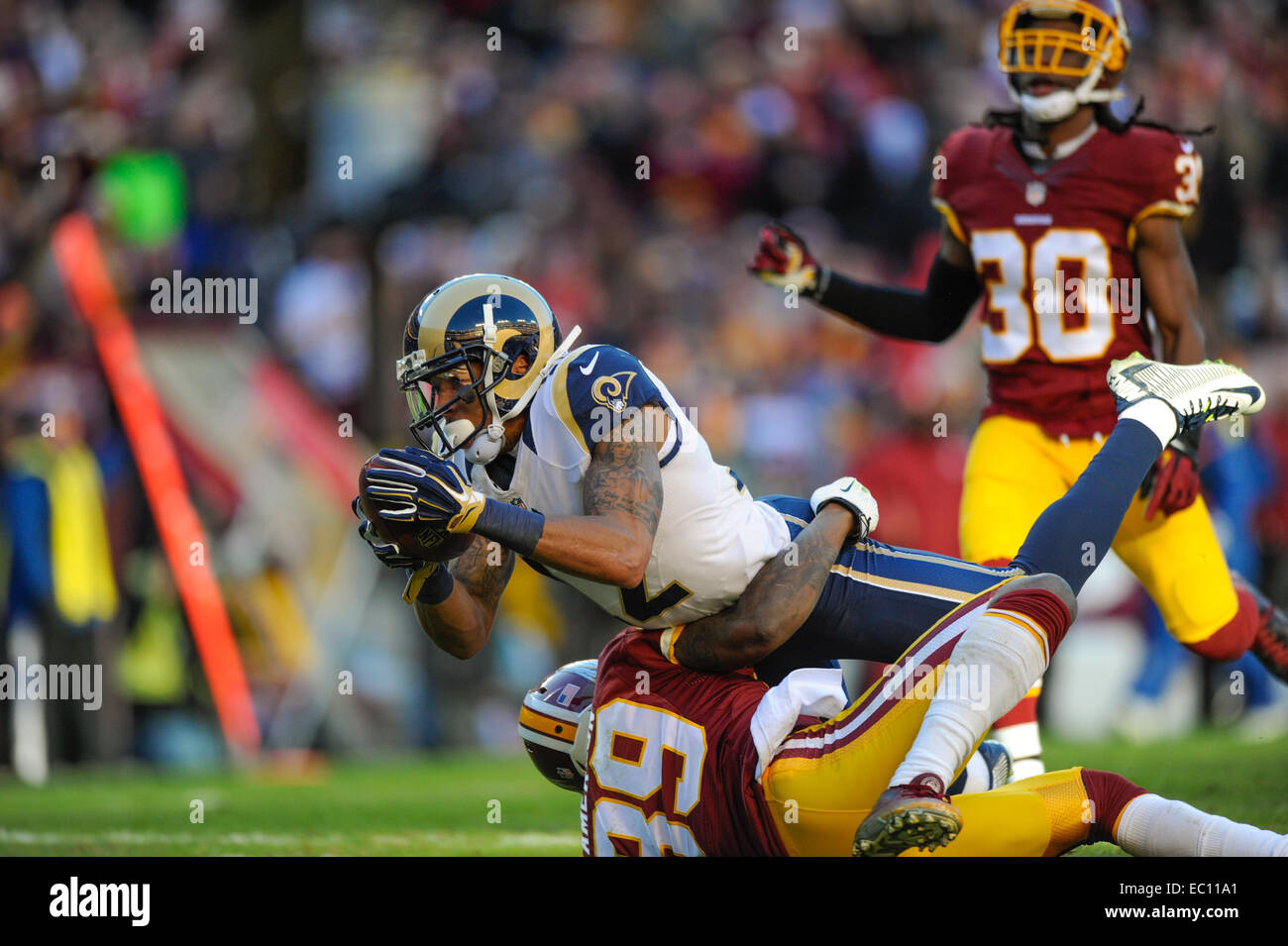 Landover, Maryland, USA. 07th Dec, 2014. Washington Redskins cornerback David Amerson (39) tries to tackle St. Louis Rams wide receiver Stedman Bailey (12) during the matchup between the St. Louis Rams and the Washington Redskins at FedEx Field in Landover, MD. Credit:  Cal Sport Media/Alamy Live News Stock Photo