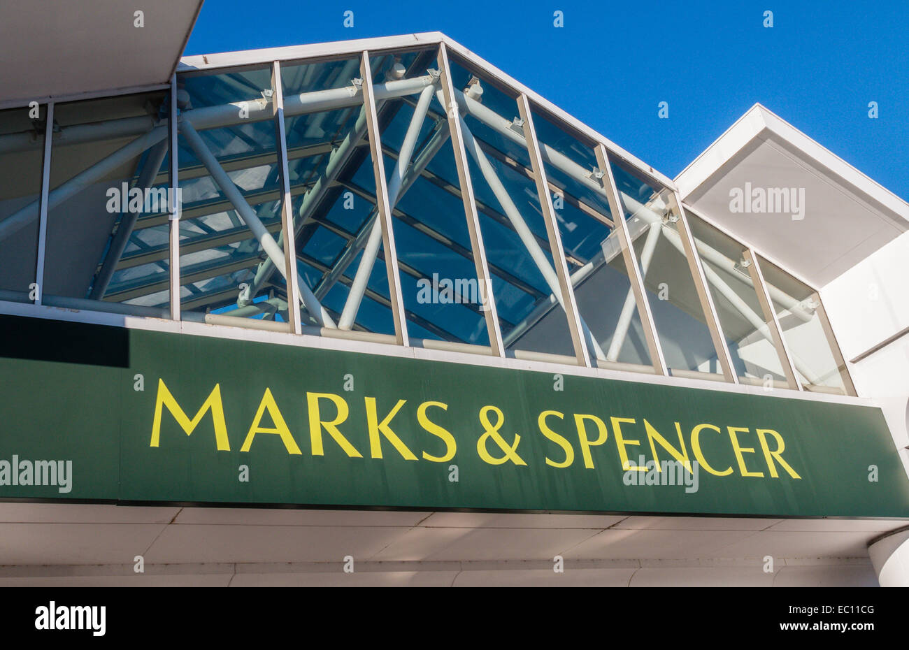 Marks and Spencer sign including logo on the roof of their Handforth Dean retail store Stock Photo