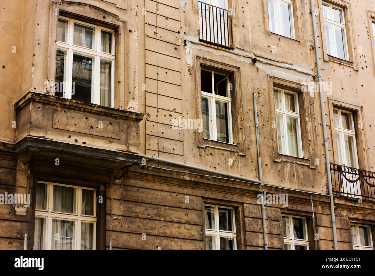 One exterior wall of a building in Mitte showing bullet holes from World War 2 has been intentionally left unrestored. Stock Photo