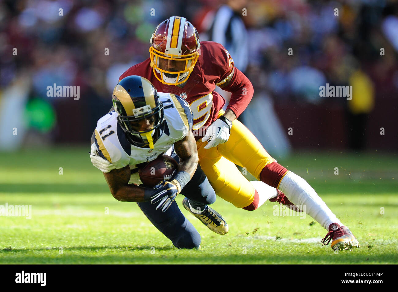 Landover, Maryland, USA. 07th Dec, 2014. Washington Redskins cornerback David Amerson (39) tackles St. Louis Rams wide receiver Tavon Austin (11) from behind during the matchup between the St. Louis Rams and the Washington Redskins at FedEx Field in Landover, MD. Credit:  Cal Sport Media/Alamy Live News Stock Photo