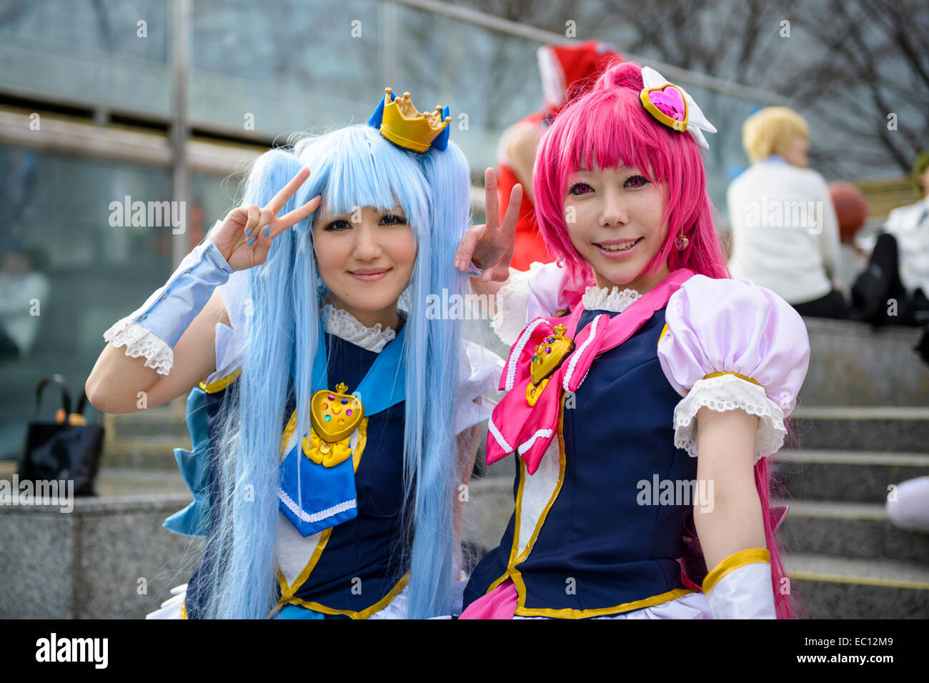 Girls dressed as anime characters pose at a cosplay gathering. Stock Photo