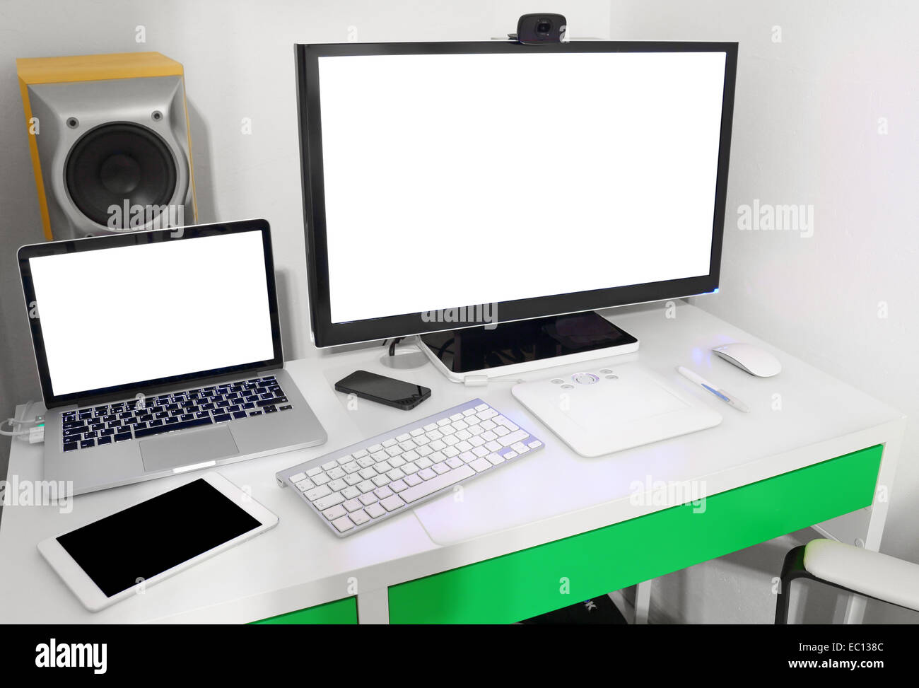 Laptop On The Computer Desk With Monitor And Keyboard