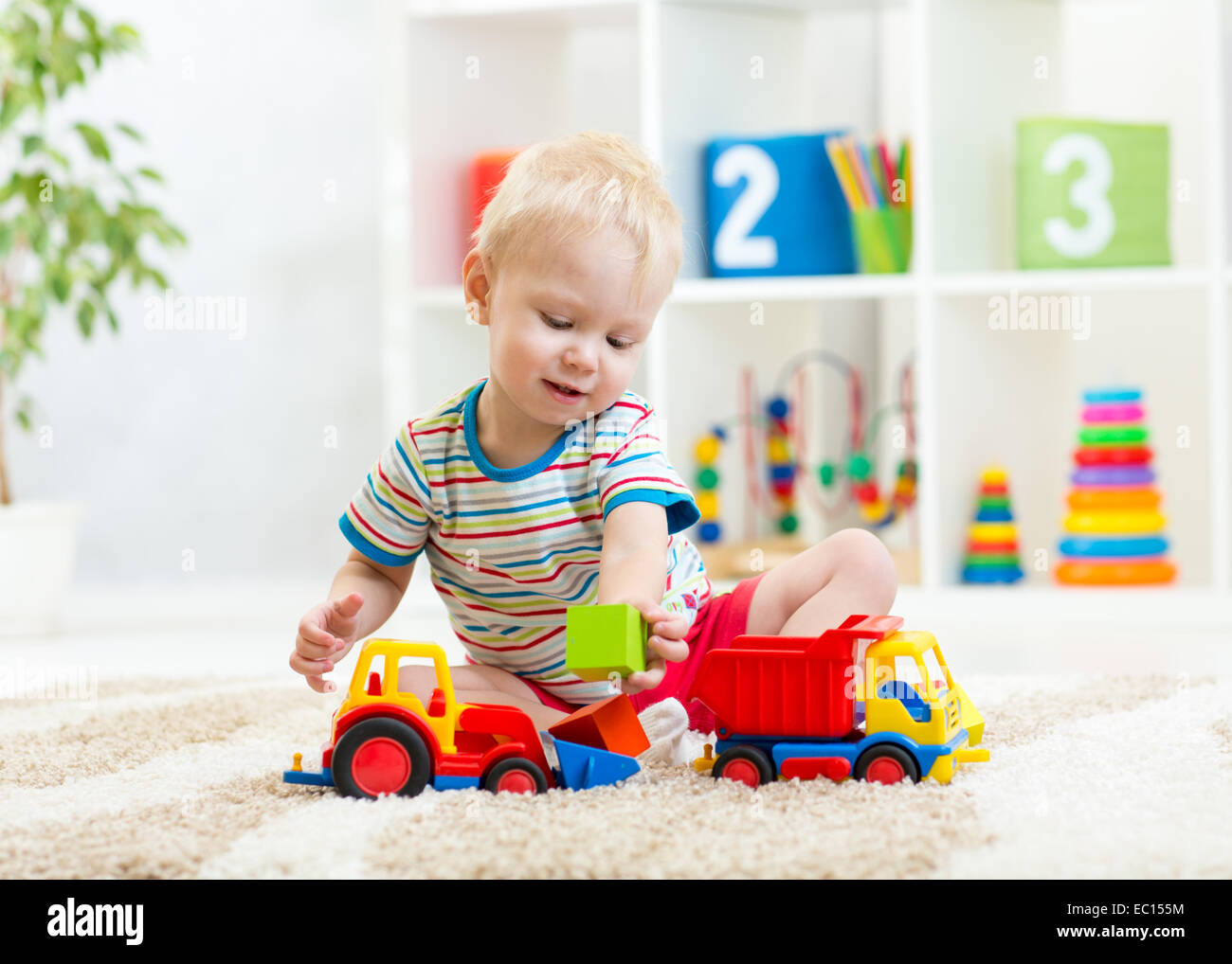 kid boy toddler playing with toy car Stock Photo - Alamy
