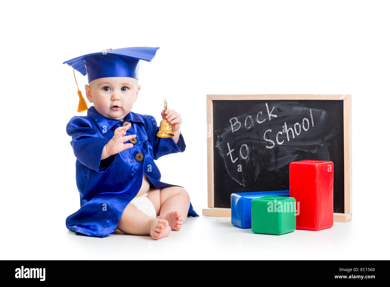 funny kid with bell in academician clothes at chalkboard Stock Photo