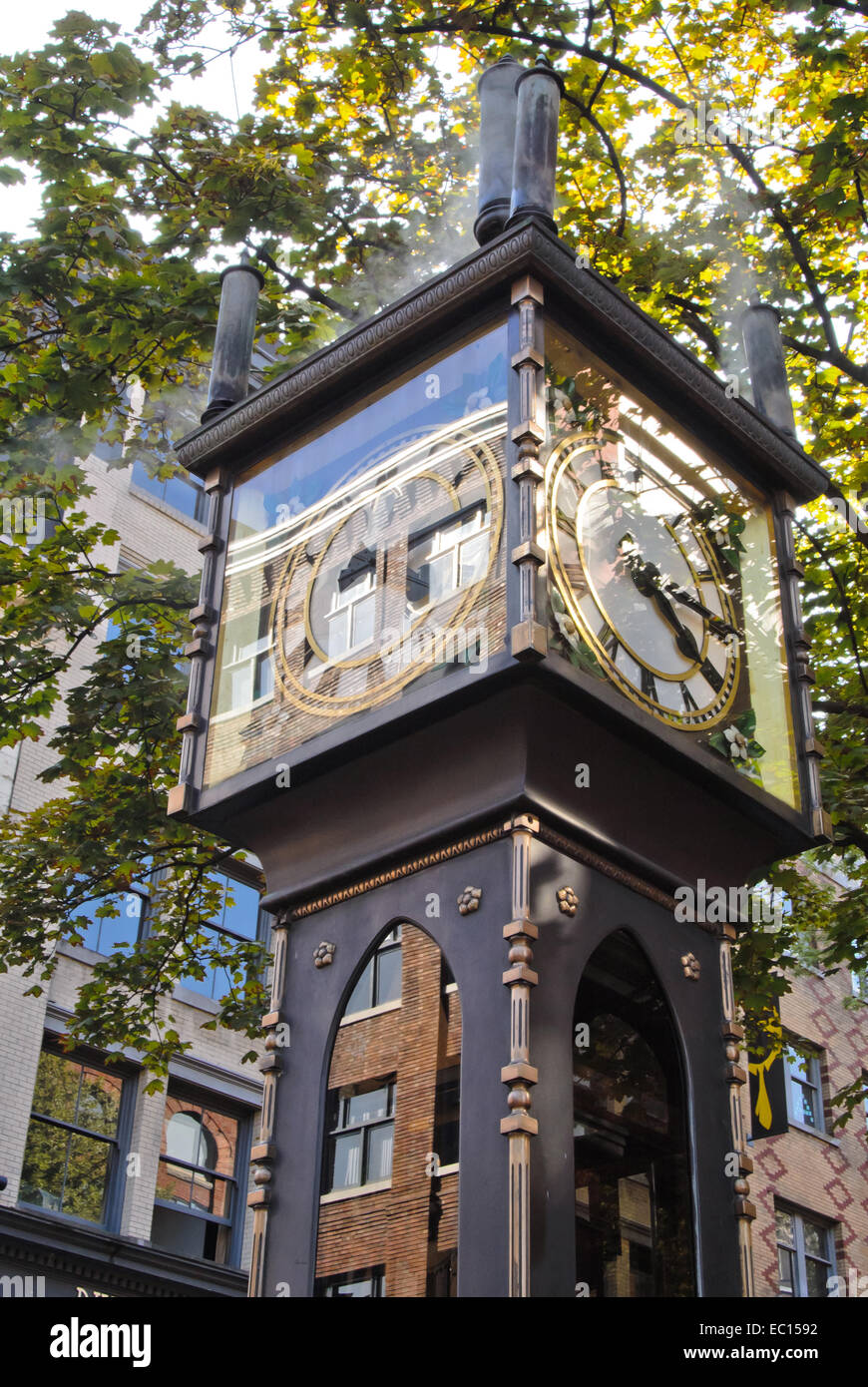 Steam clock surrounded by trees Stock Photo