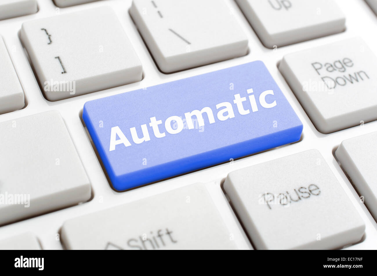 Blue automatic key on keyboard Stock Photo