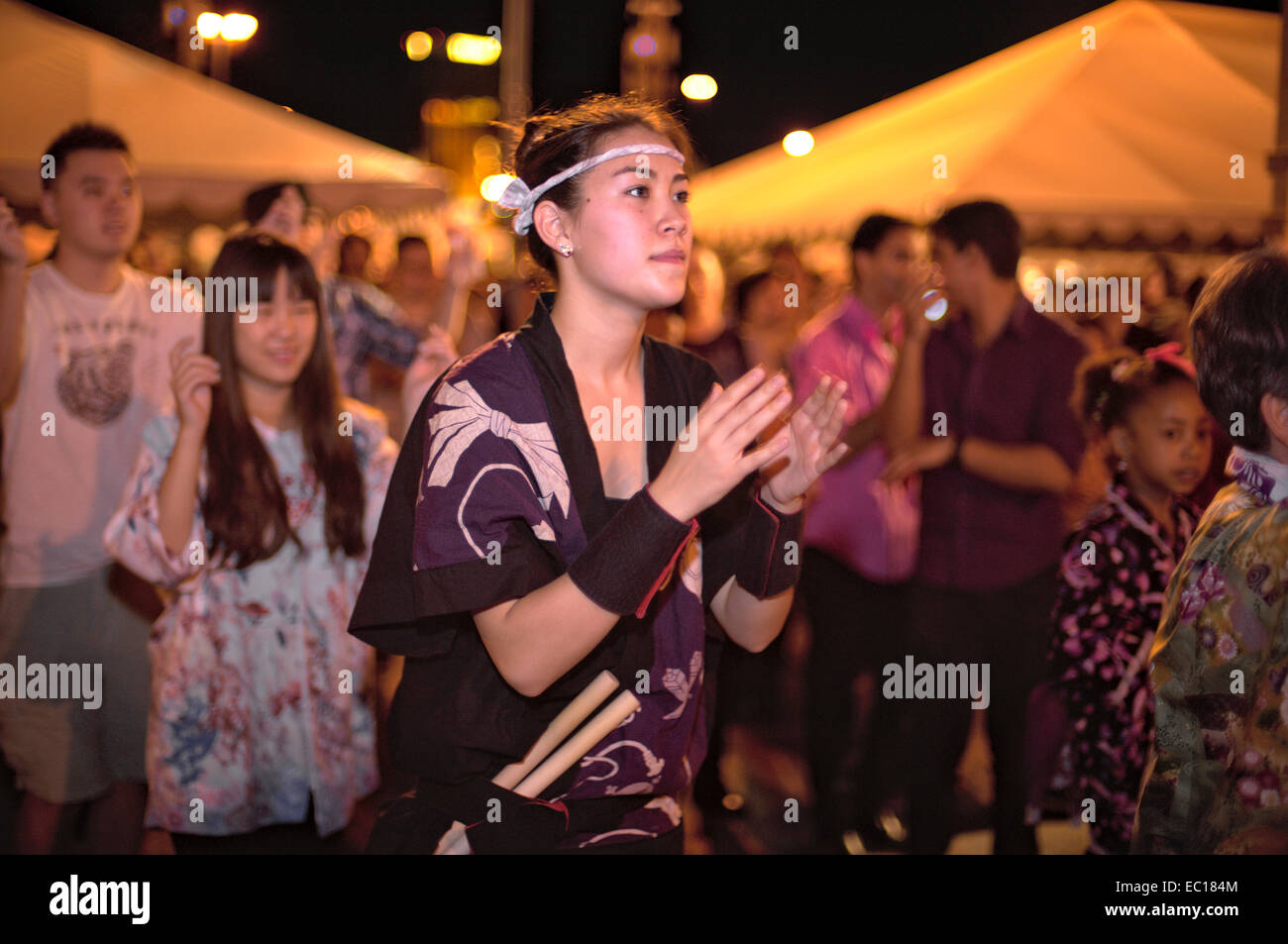 Festival participants dancing during the Bon Odori dance at the Las Vegas Akimatsuri, October 25, 2014. Dancers dance around the Stock Photo