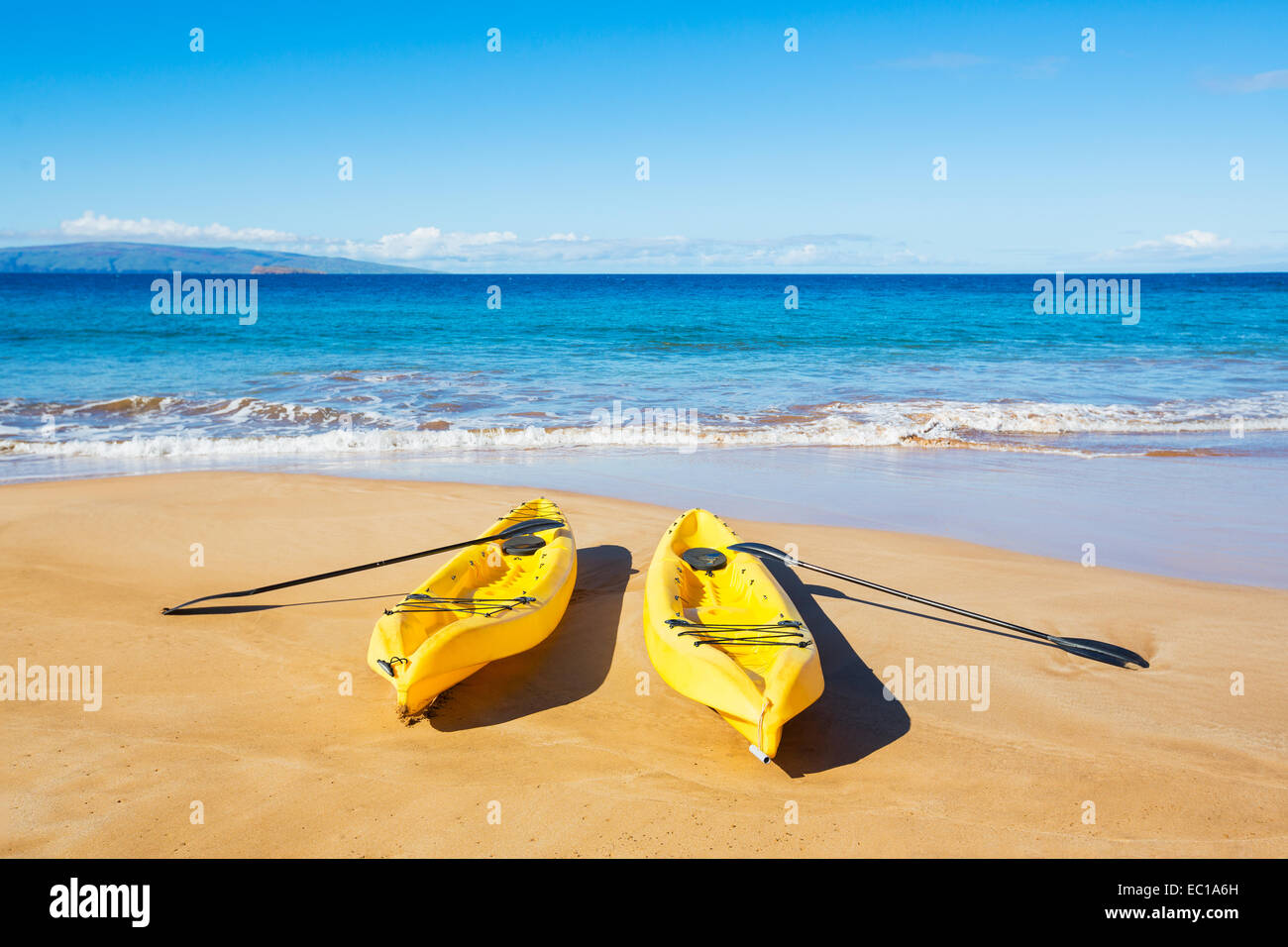 Two Yellow Ocean Kayaks on Sunny Tropical Beach Stock Photo