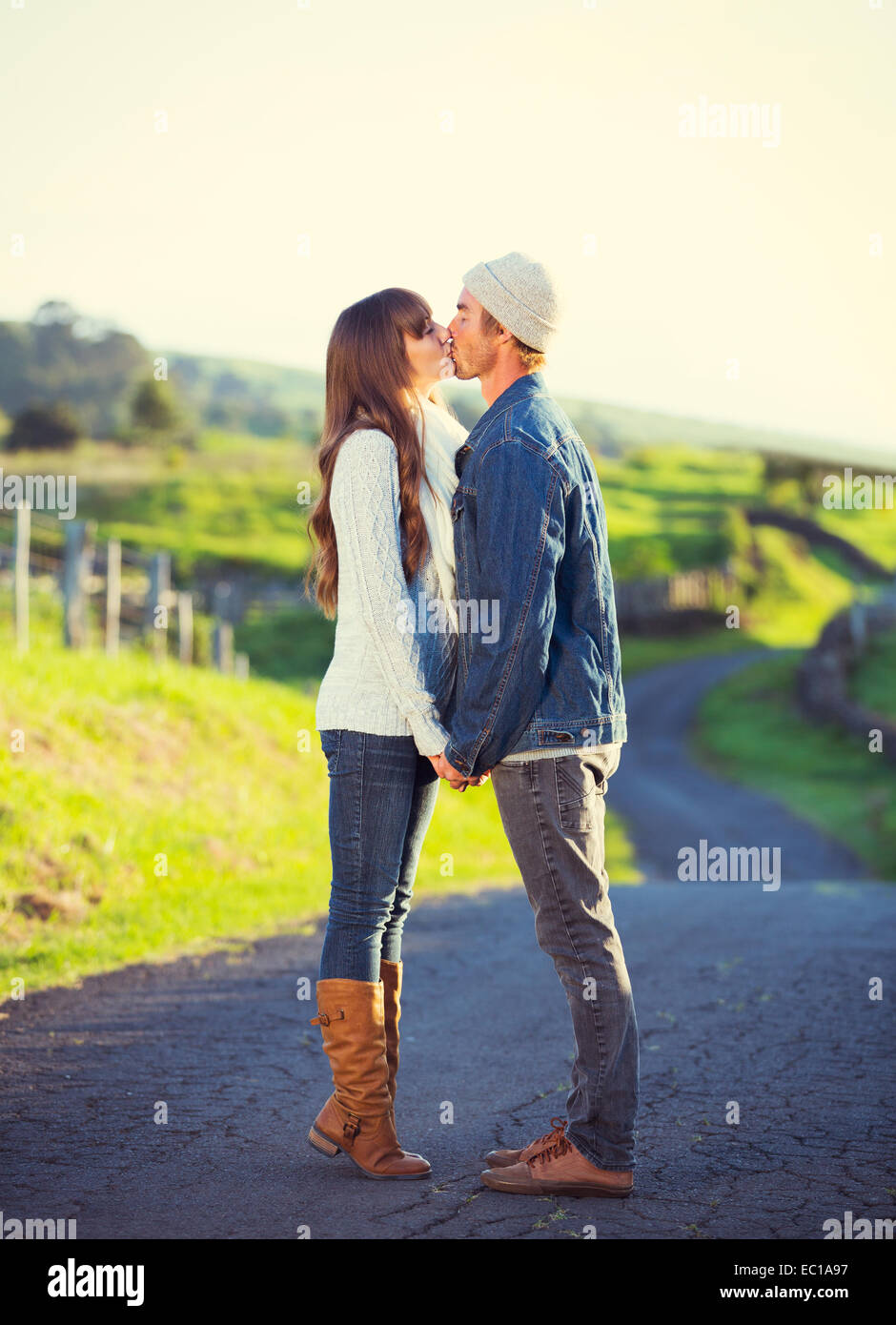 Romantic Young Couple in Love Outdoors on Country Road Stock Photo
