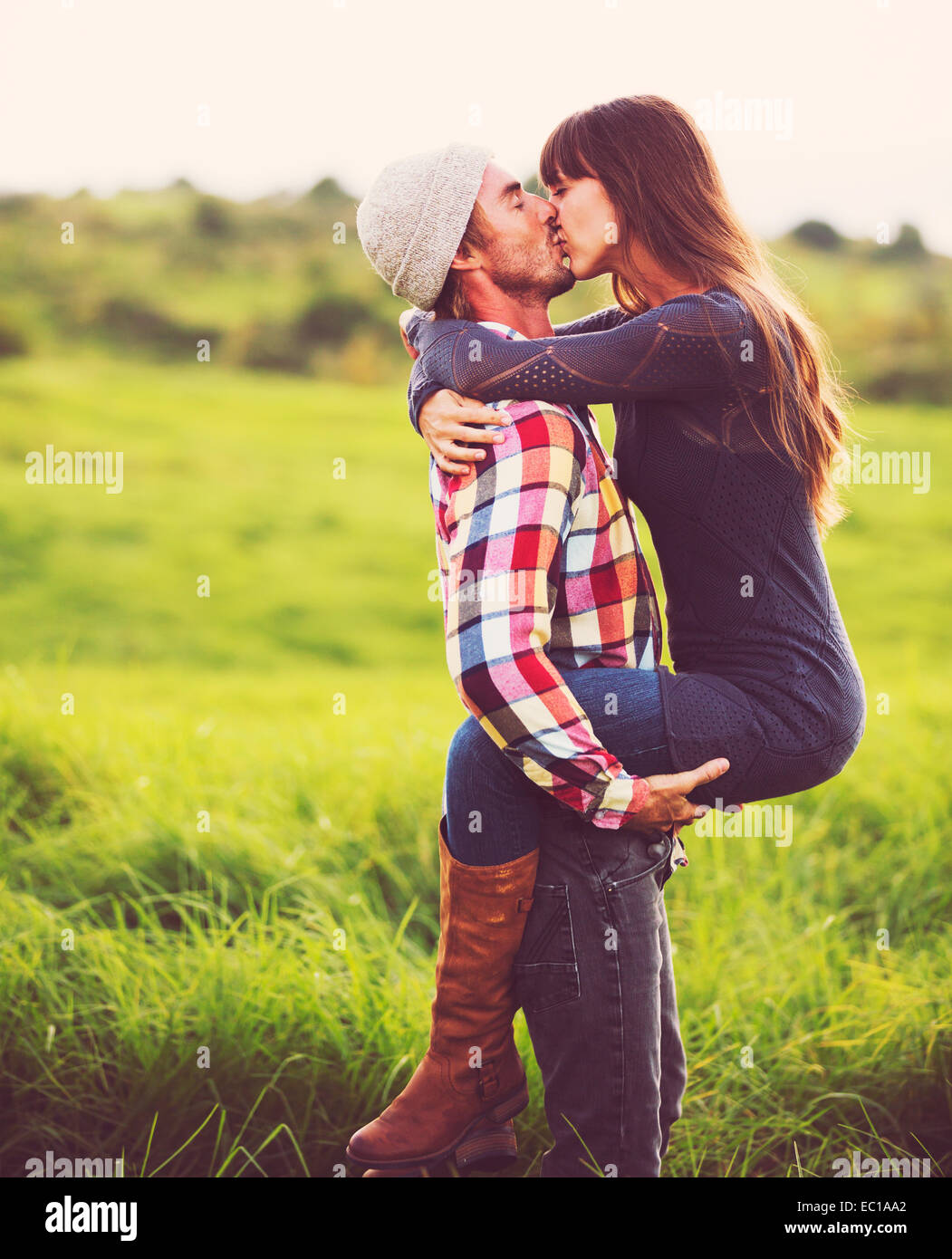 Happy Romantic Young Couple in Love Outdoors Stock Photo