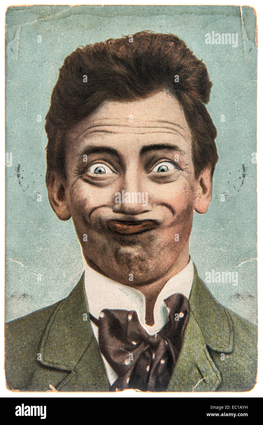 funny handsome man with crazy smile. vintage aged paper picture Stock Photo