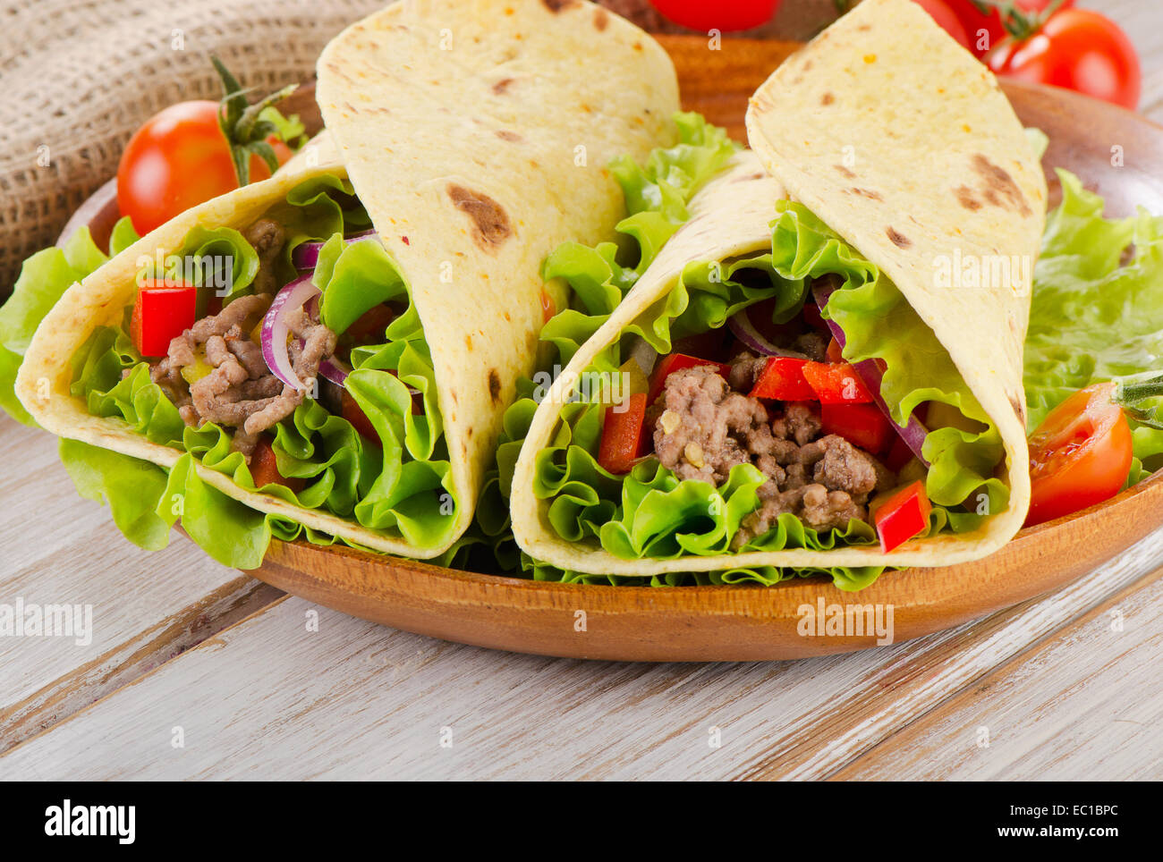 tortilla wraps with meat and vegetables. Selective focus Stock Photo