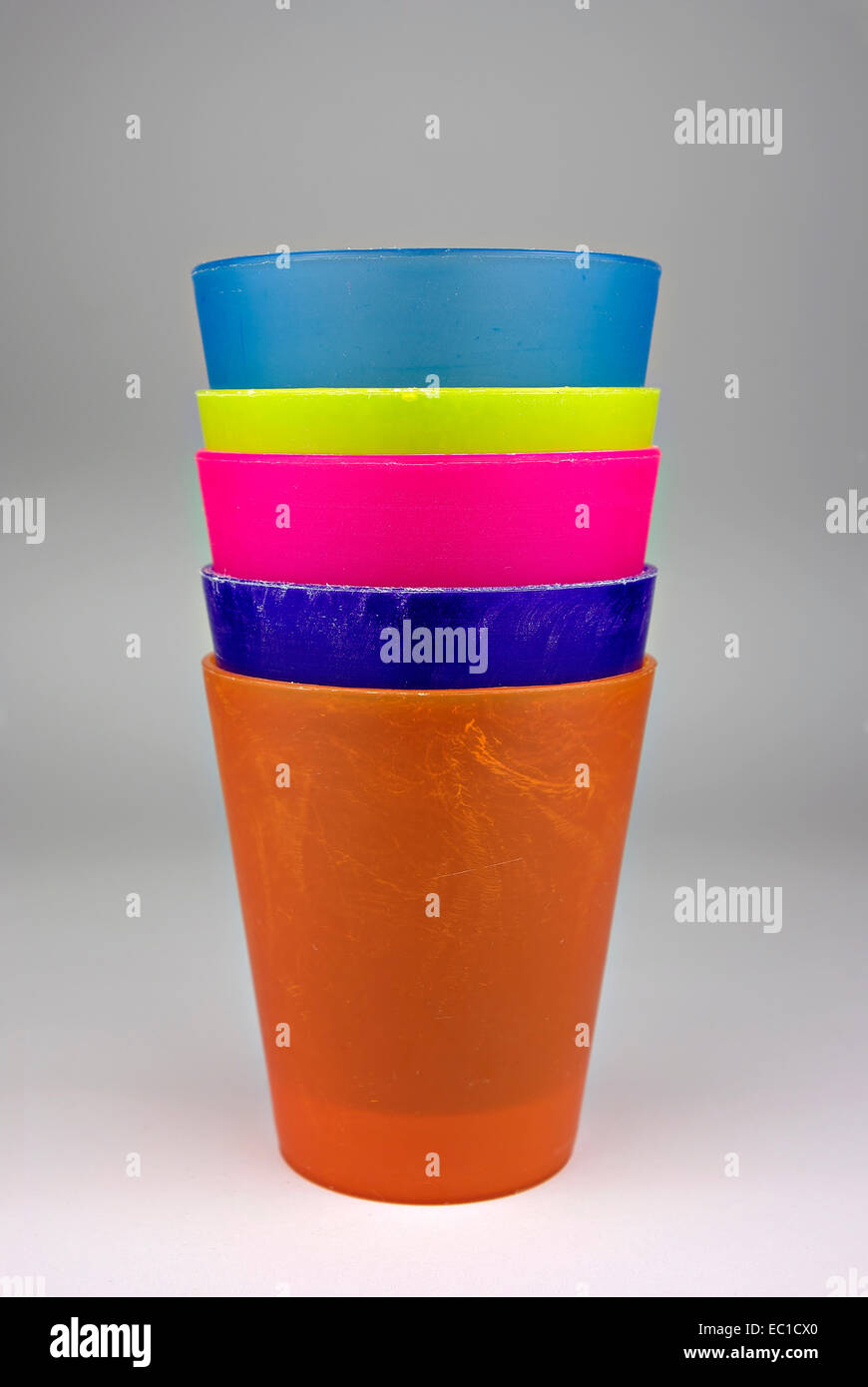 Colorful plastic glasses, stacked and ready for use Stock Photo Alamy