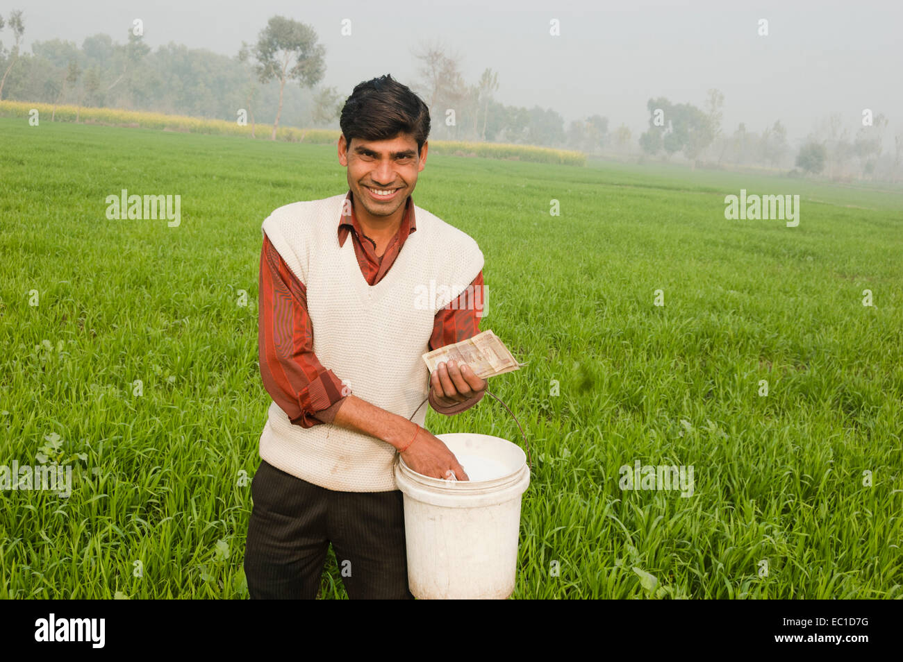 1 Indian Farmer Working in Farm and Counting Money Stock Photo
