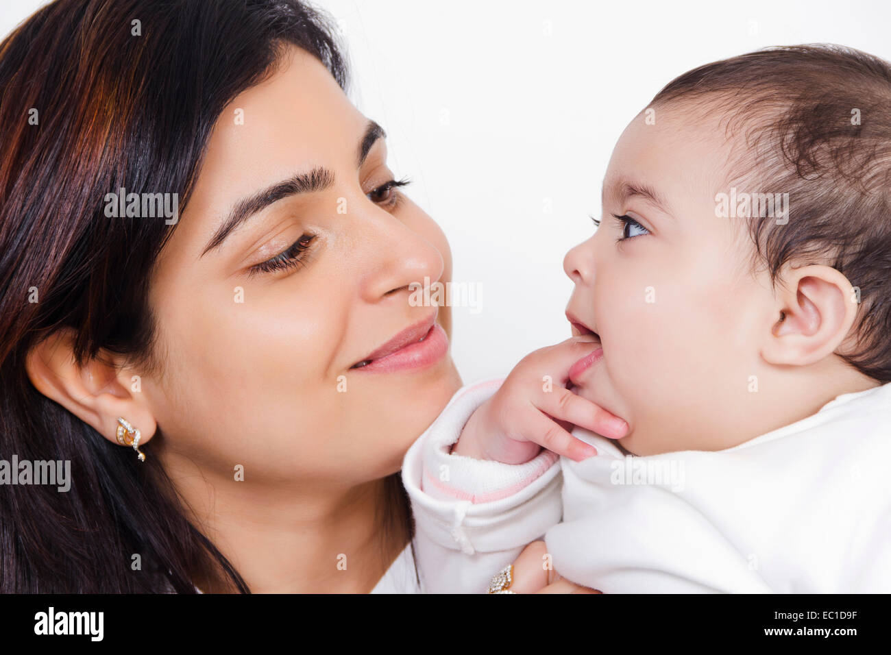 Indian Mother Caring his Baby Stock Photo