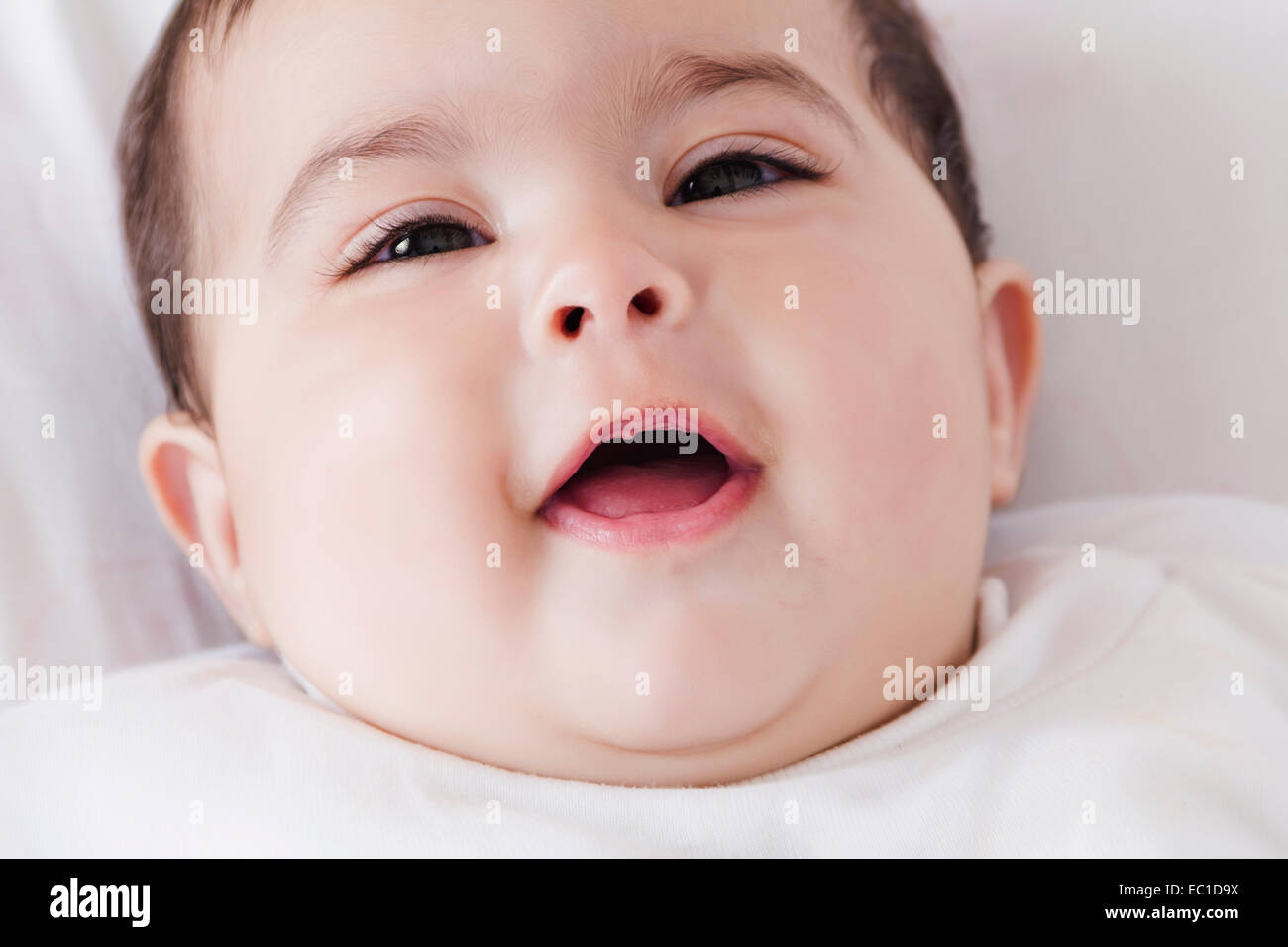 1 Indian Kid Lying Down at Home Stock Photo - Alamy