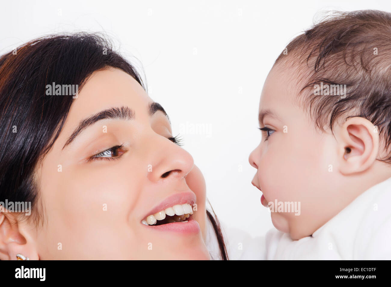 Indian Mother Caring his Baby Stock Photo