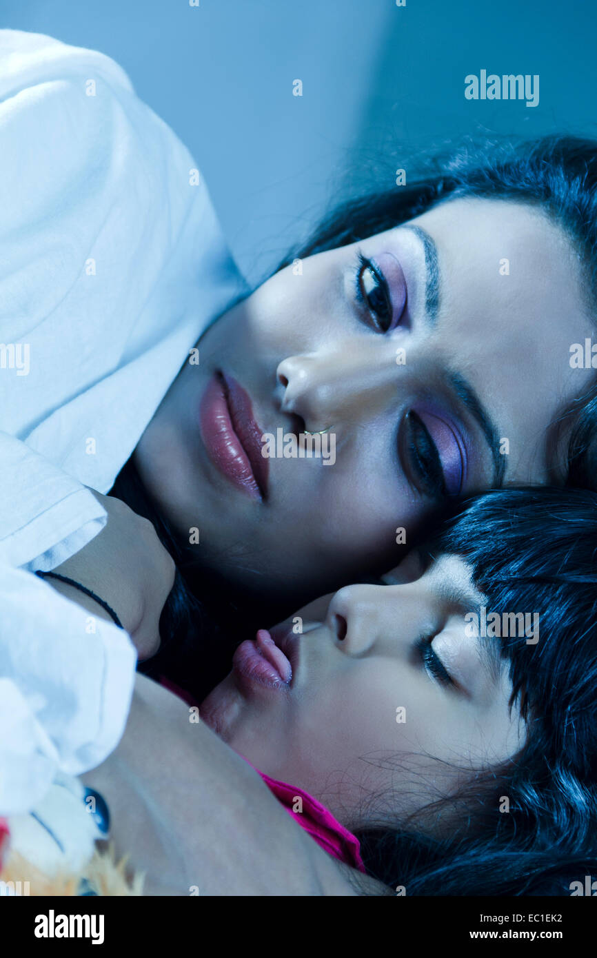 indian Mother child care Sleeping Stock Photo