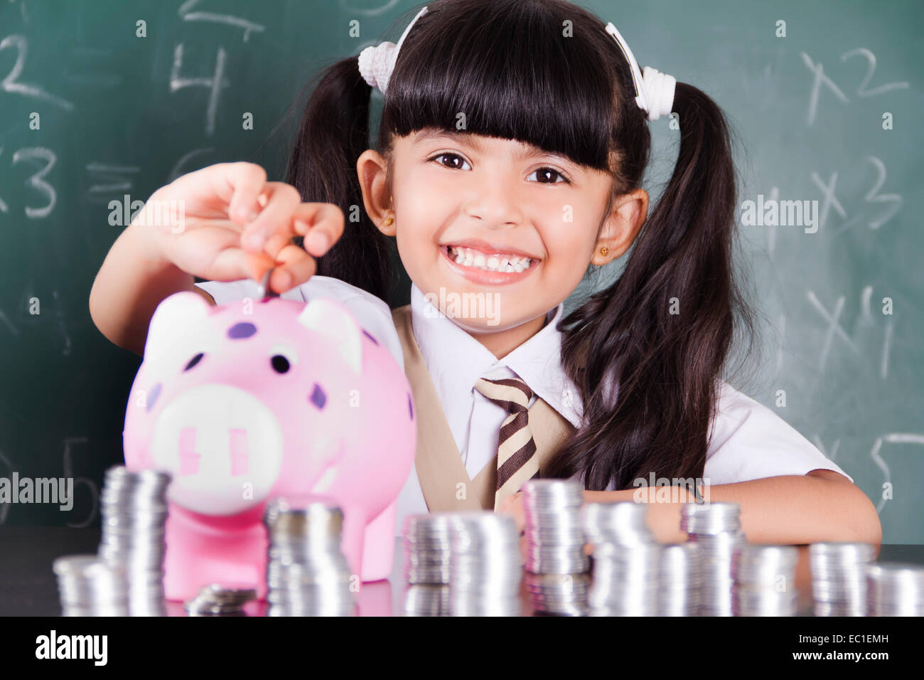 indian Beautiful child Student with Money Stock Photo