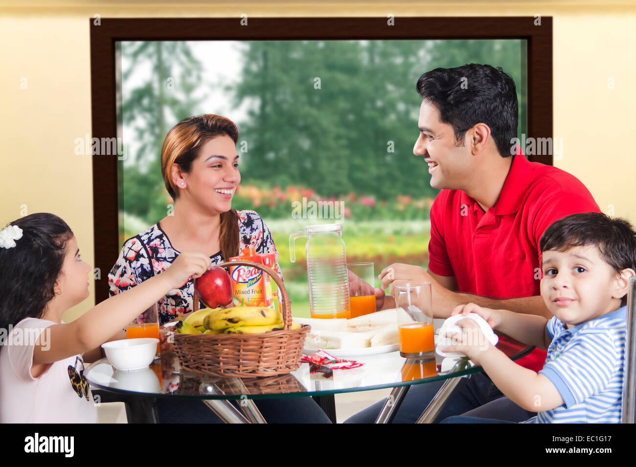 indian Parents with child  Breakfast Stock Photo