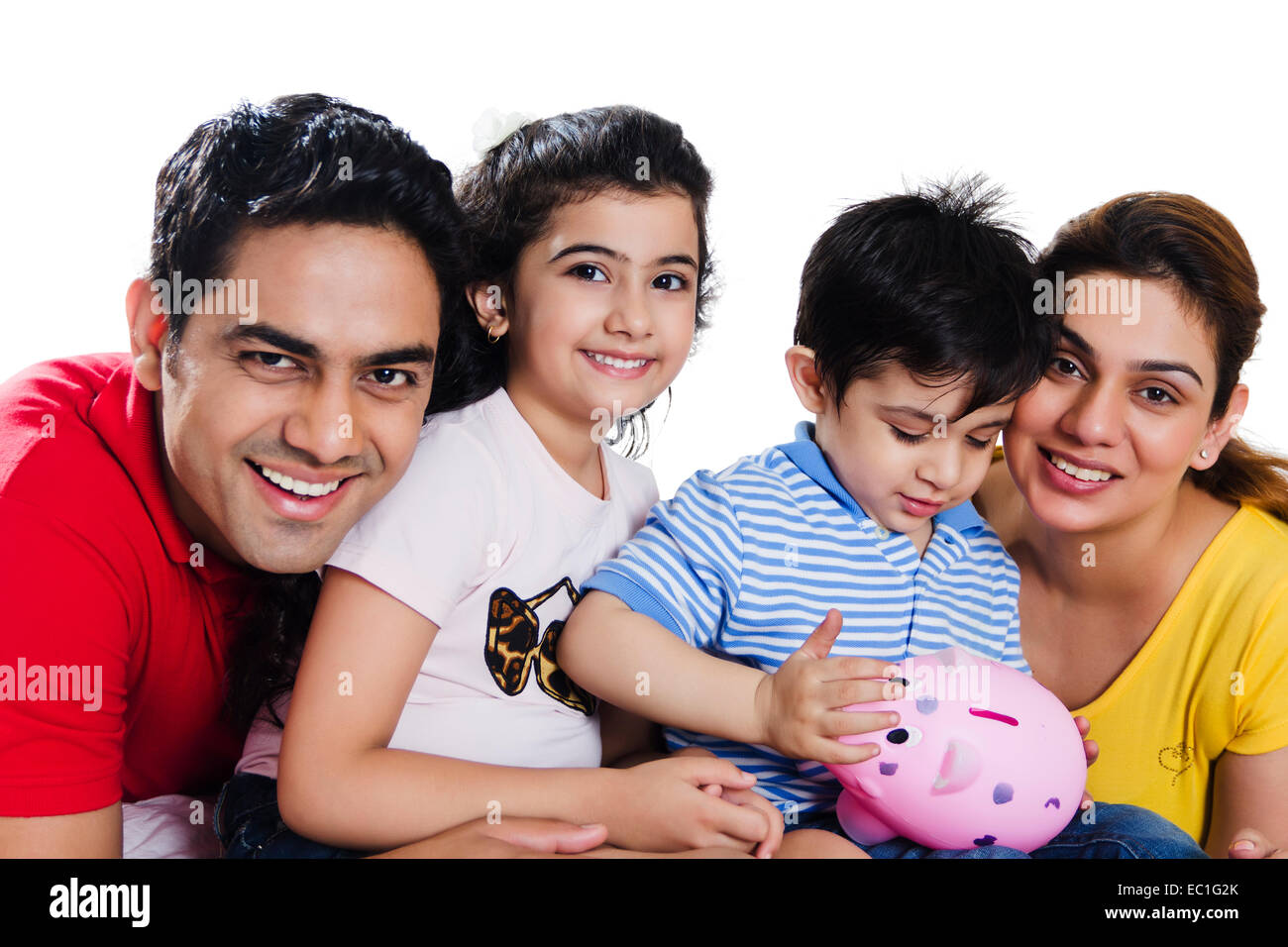 indian Parents with children saving money Stock Photo