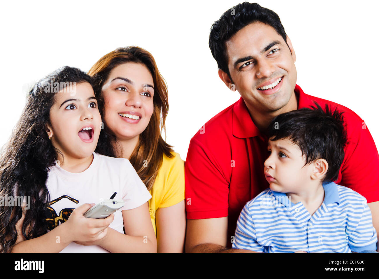 indian Parents with children showing Television Stock Photo