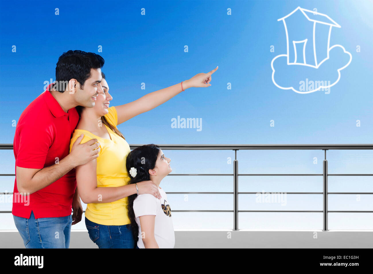 indian Parents with child Balcony side  showing Stock Photo