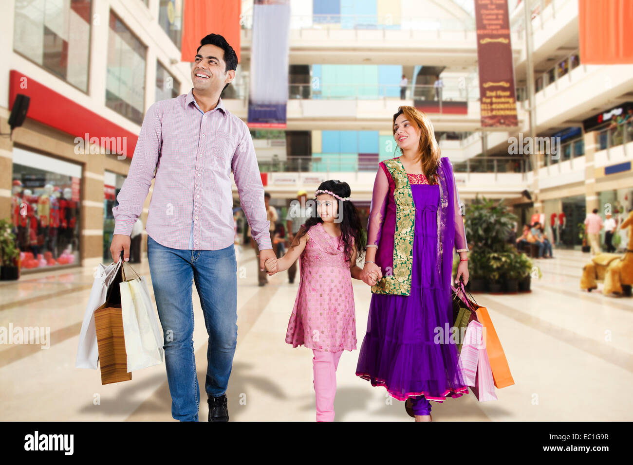 indian Parents with child mall Shopping Stock Photo