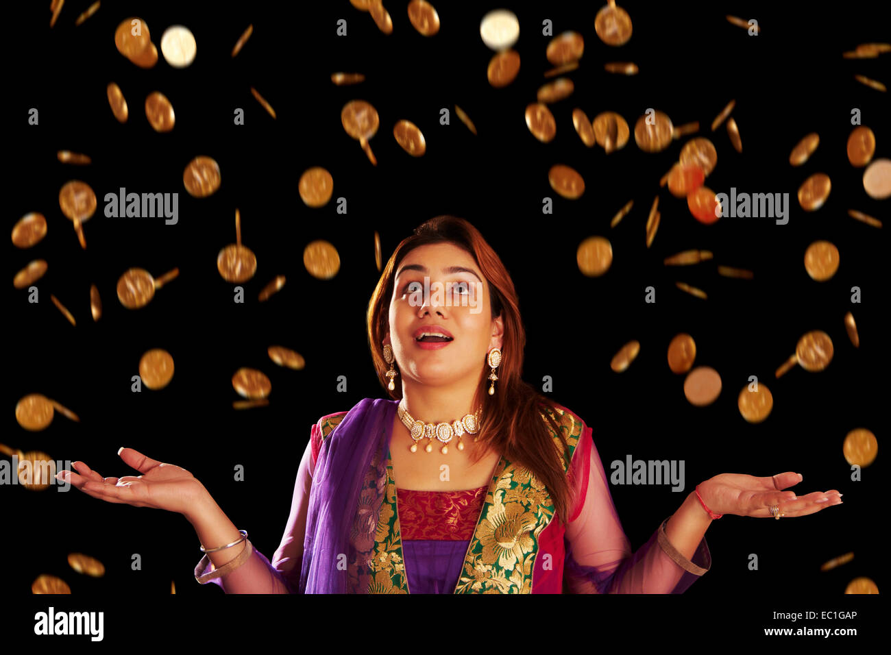 indian lady Diwali Lottery Gold Coin Stock Photo