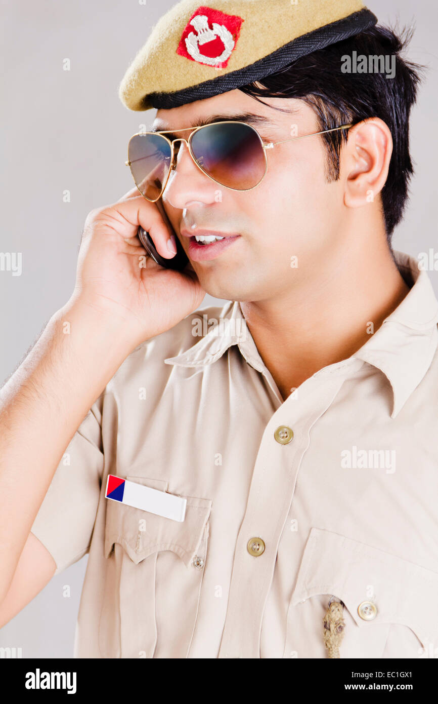 1 Indian Police man Constable talking Mobile phone Stock Photo