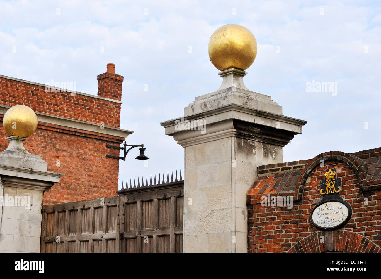 plaque, royal coat of arms and gold ball, dating from 1711, on the gates of Portsmouth Historic Dockyard, where the father of Stock Photo