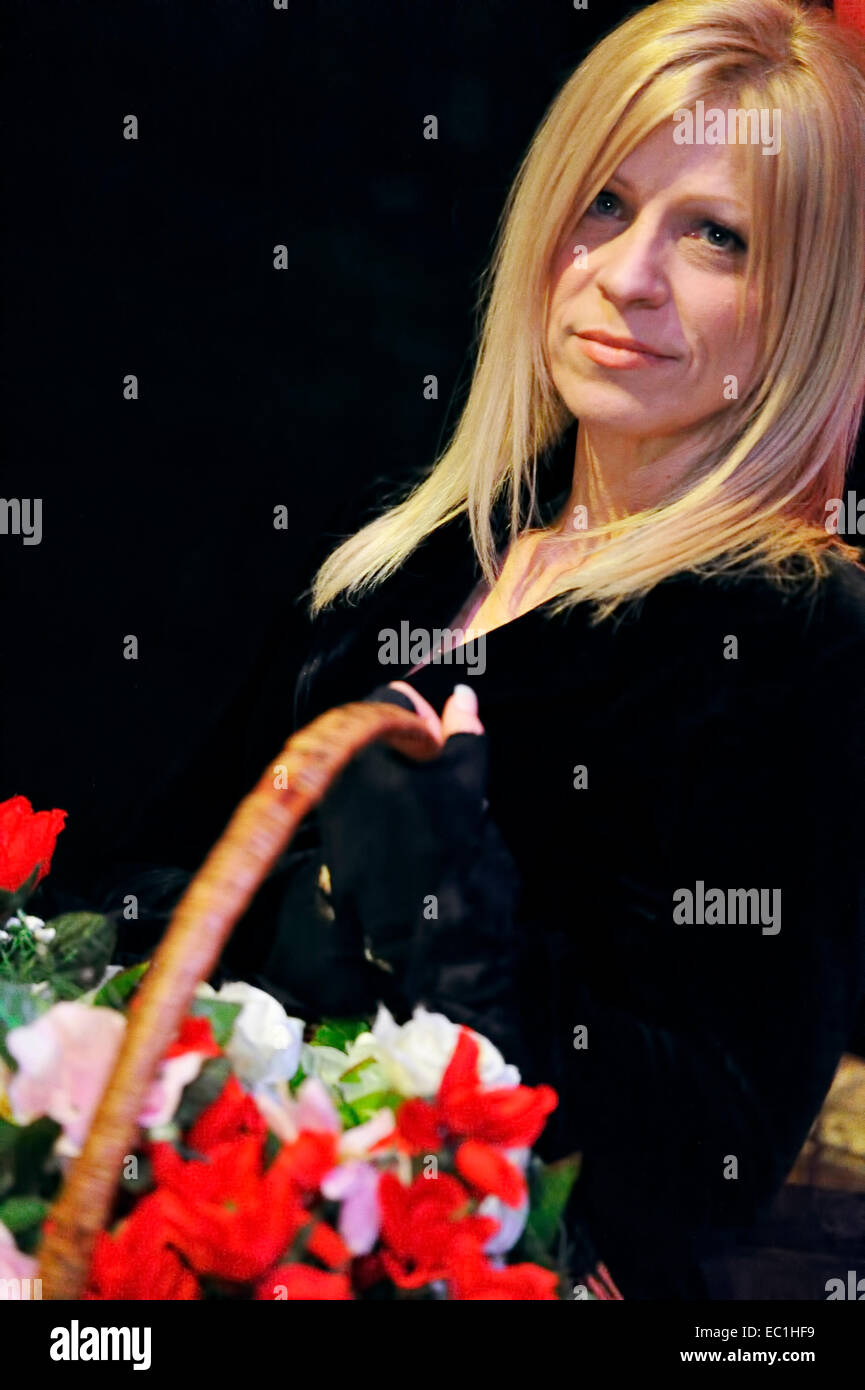 “Nancy” at Dickens World: actress Jennifer Lane with flower basket, in the role of Nancy from Dickens's novel “Oliver Twist”; Stock Photo