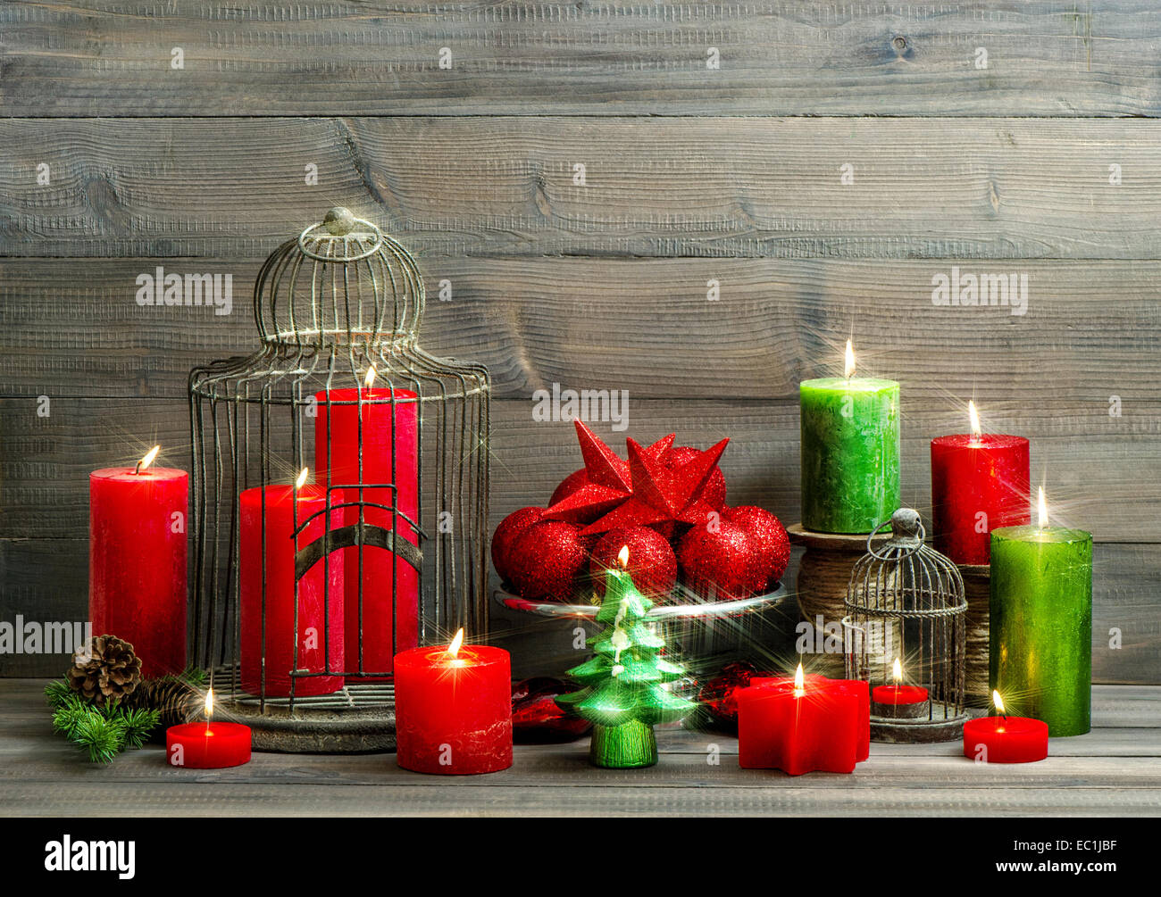 christmas decoration with burning candles. nostalgic home interior with magic lights Stock Photo