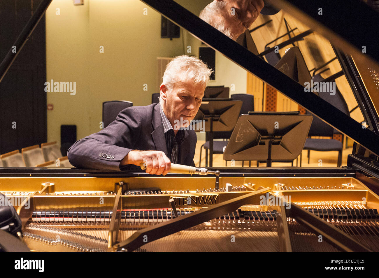 Piano tuner tuning Steinway concert grand piano, National Concert Hall, Dublin.a Stock Photo