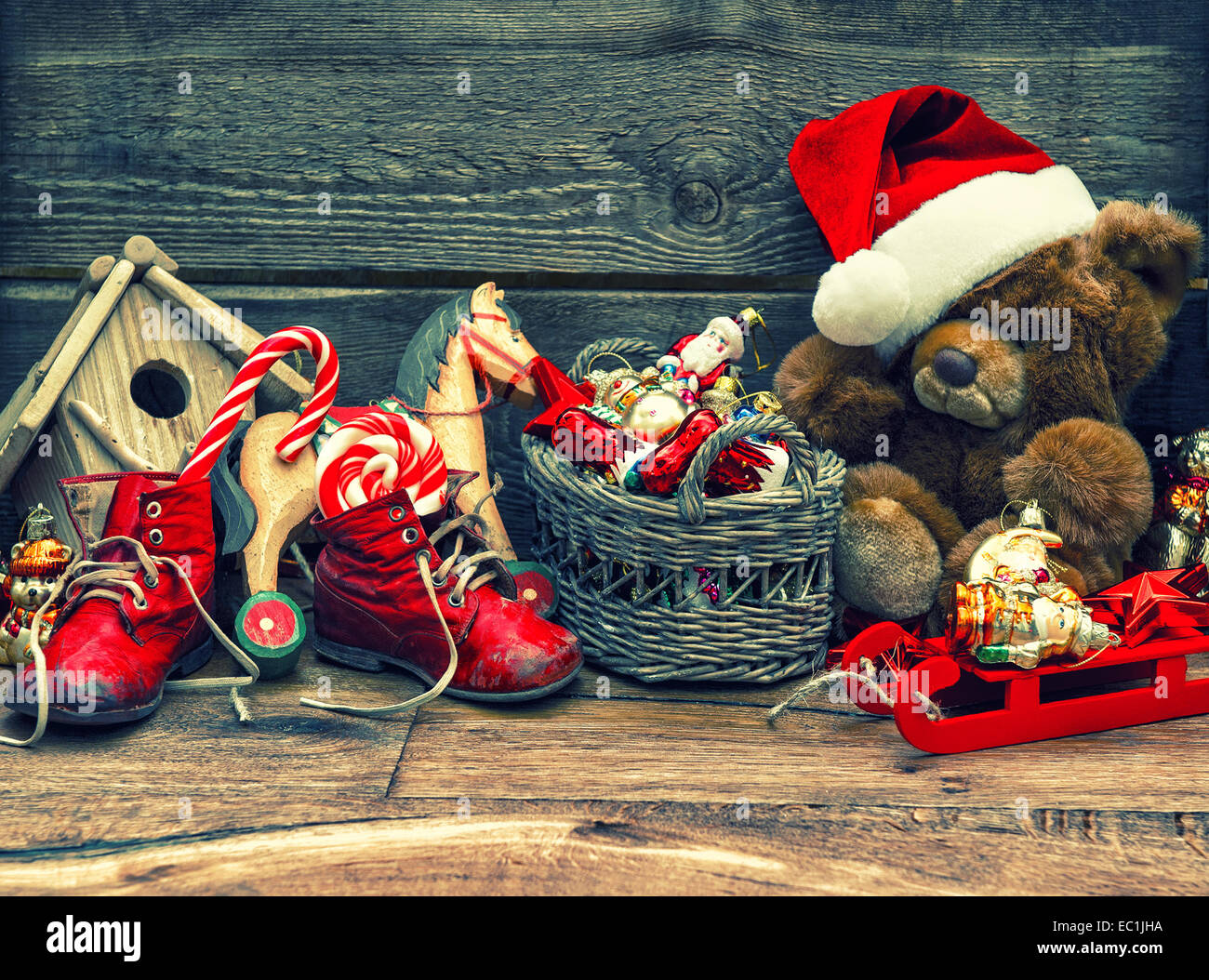 nostalgic christmas decoration with antique toys over wooden background. vintage style toned picture Stock Photo