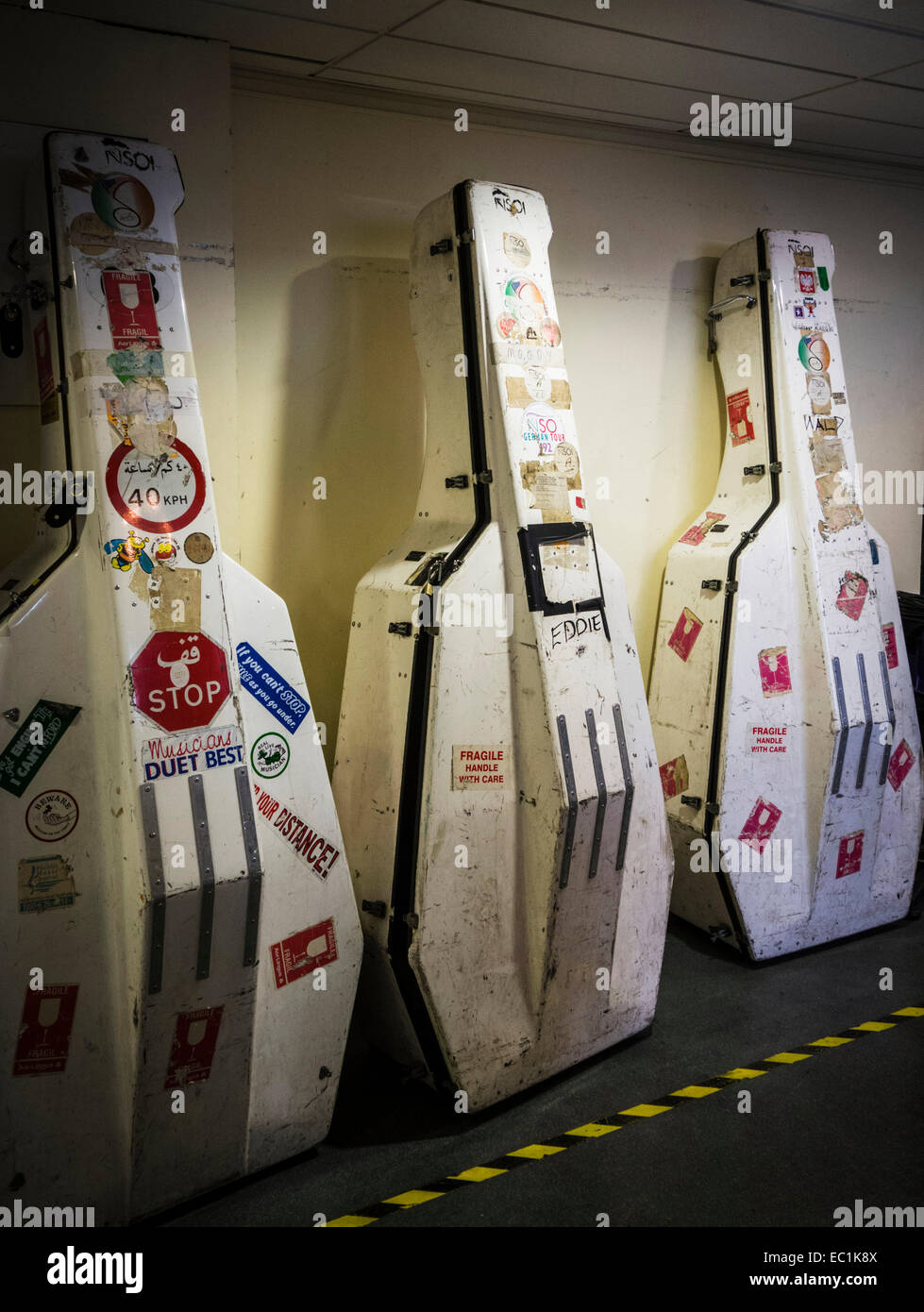 Double bass cases covered in stickers. Stock Photo