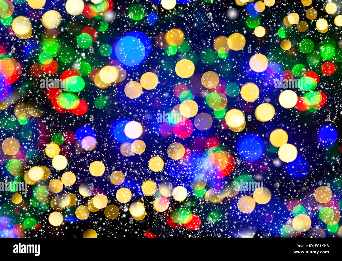 defocused lights with snowfall effect. winter night at the city