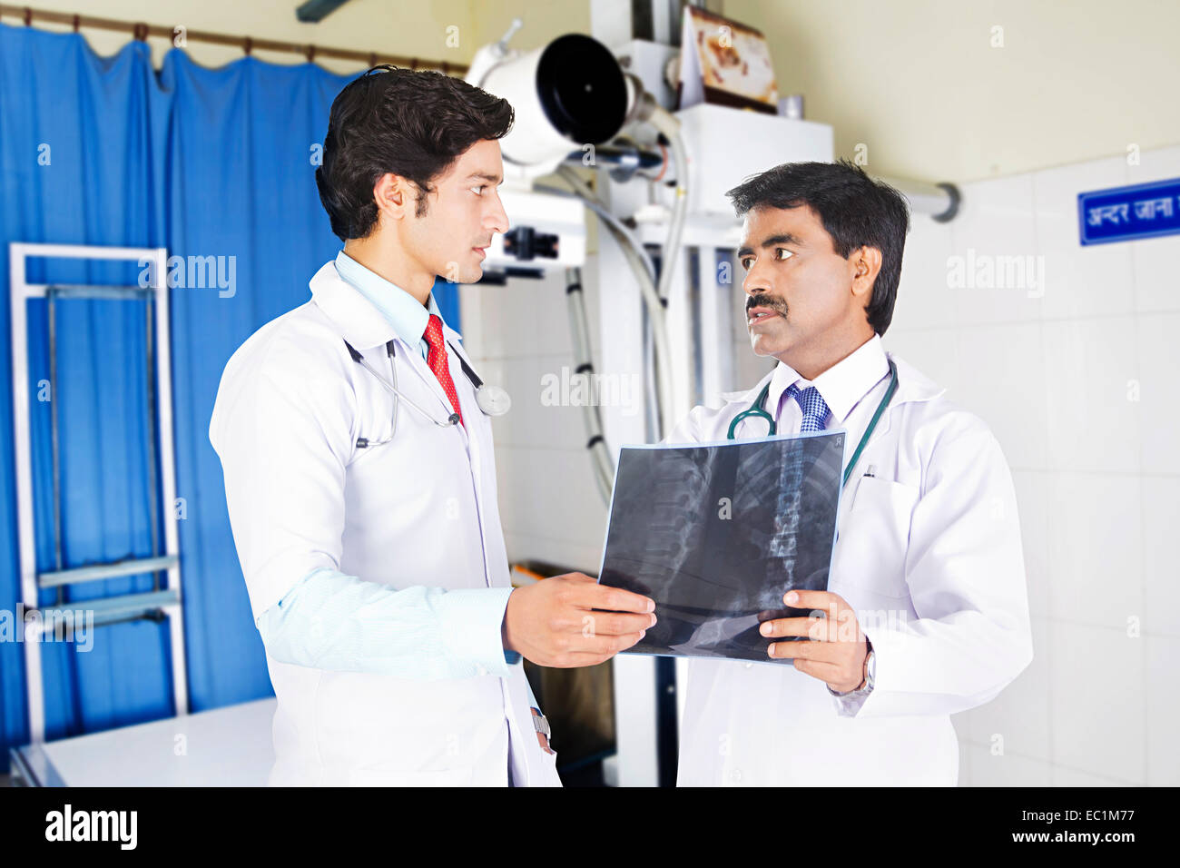 two indian Doctor X-Ray Report Stock Photo