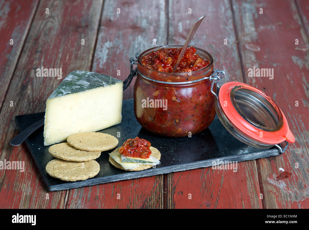 Cheese and biscuits with tomato chutney. Stock Photo