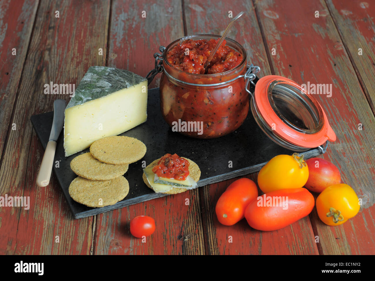 Cheese and biscuits with tomato chutney. Stock Photo