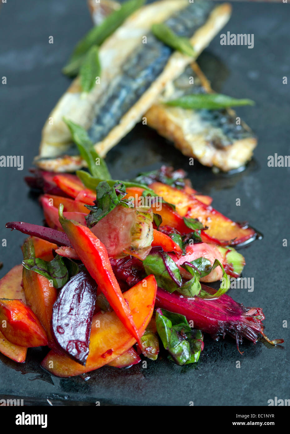 Roast vegetables with fillets of sea bass Stock Photo Alamy