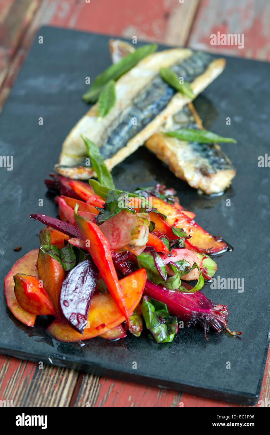 Roast vegetables with fillets of sea bass Stock Photo Alamy