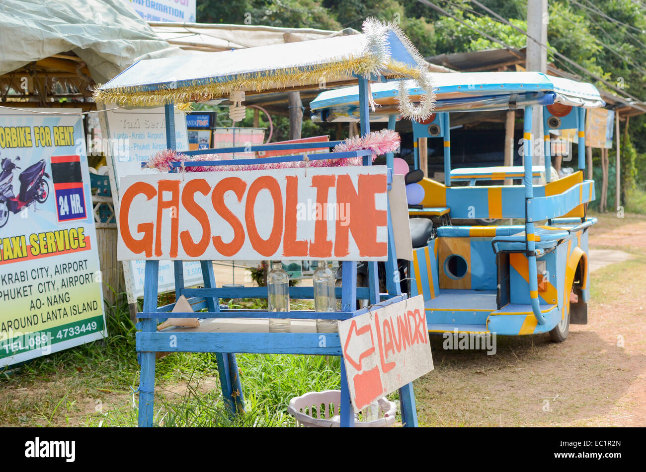 Roadside gasoline fuel filling station stall with song tao, Koh Lanta, Thailand Stock Photo