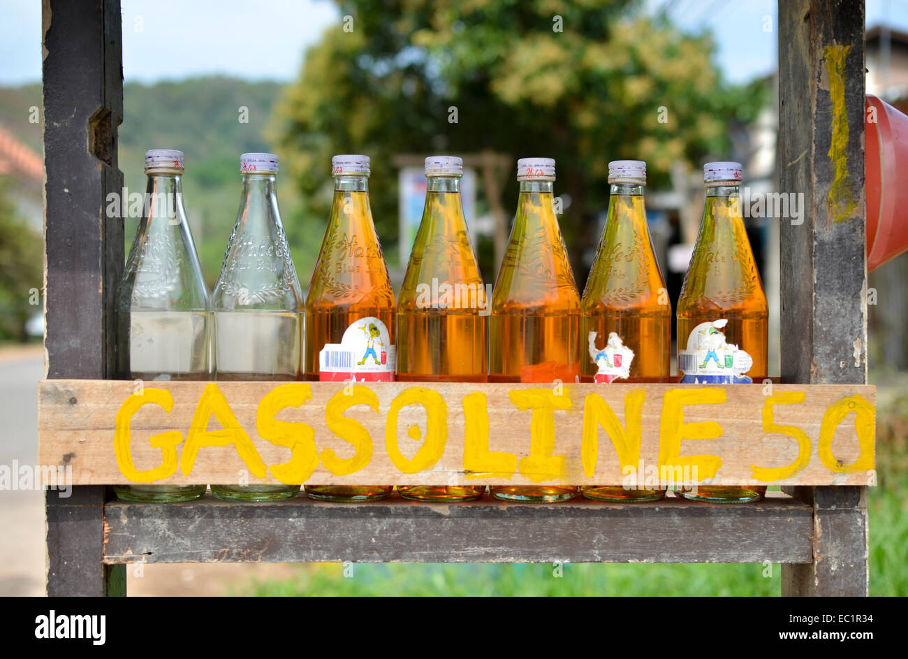Close-up of gasoline bottles for sale at Thai roadside service station, Koh Lanta, Thailand Stock Photo