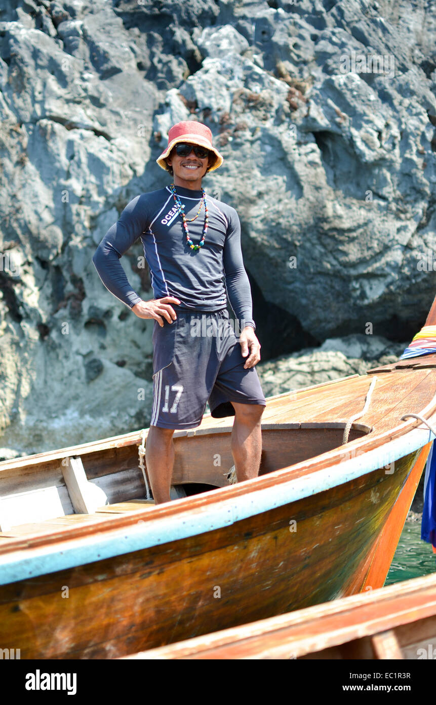 Thai Fisherman in Thai longtail boat smiling at the camera, Koh Lanta,  Thailand, South East Asia Stock Photo - Alamy