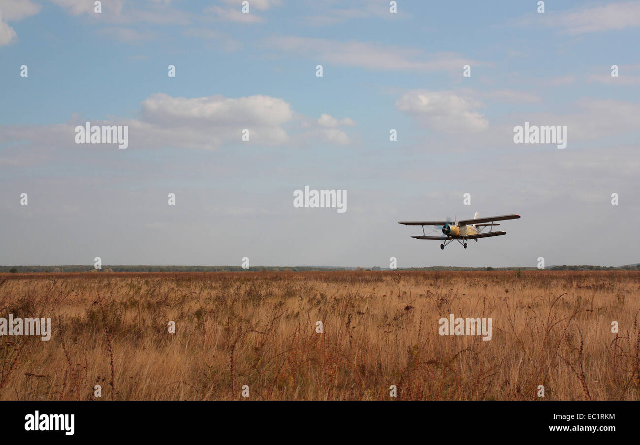 The old plane against the cloudy sky Stock Photo - Alamy